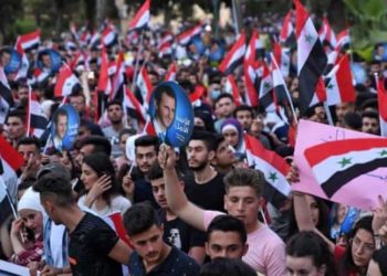 أسواق دمشق تغلق وسط النهار لإجبار التجار على مسيرات مؤيدة للأسد