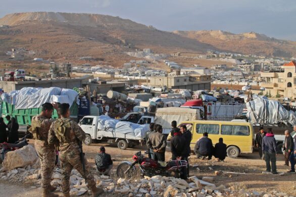 Syrians refugees prepare to leave Lebanon towards Syrian territory through the Wadi Hamid crossing in Arsal on October 26, 2022. A first batch of Syrian refugees left Lebanon today for their home country, an AFP photographer said, the first step in a new repatriation plan slammed by rights groups. (Photo by AFP)