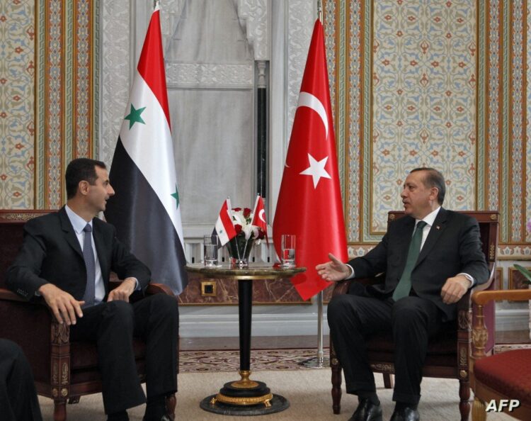 Turkey's Prime Minister Tayyip Erdogan (R) talks with Syria's President Bashar al-Assad during a meeting in Istanbul on June 7, 2010. AFP PHOTO/ POOL/ OSMAN ORSAL (Photo by OSMAN ORSAL / POOL / AFP)